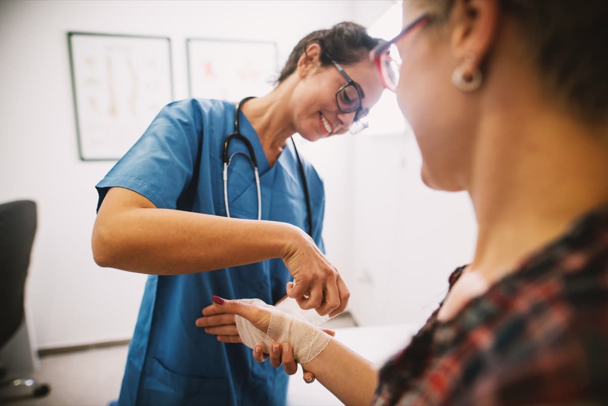 Mobile wound care clinician treating patient — Medipyxis EMR
