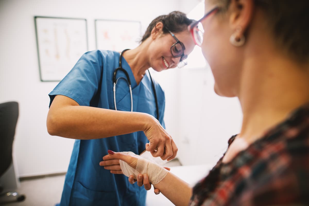 Mobile wound care clinician treating patient — Medipyxis EMR
